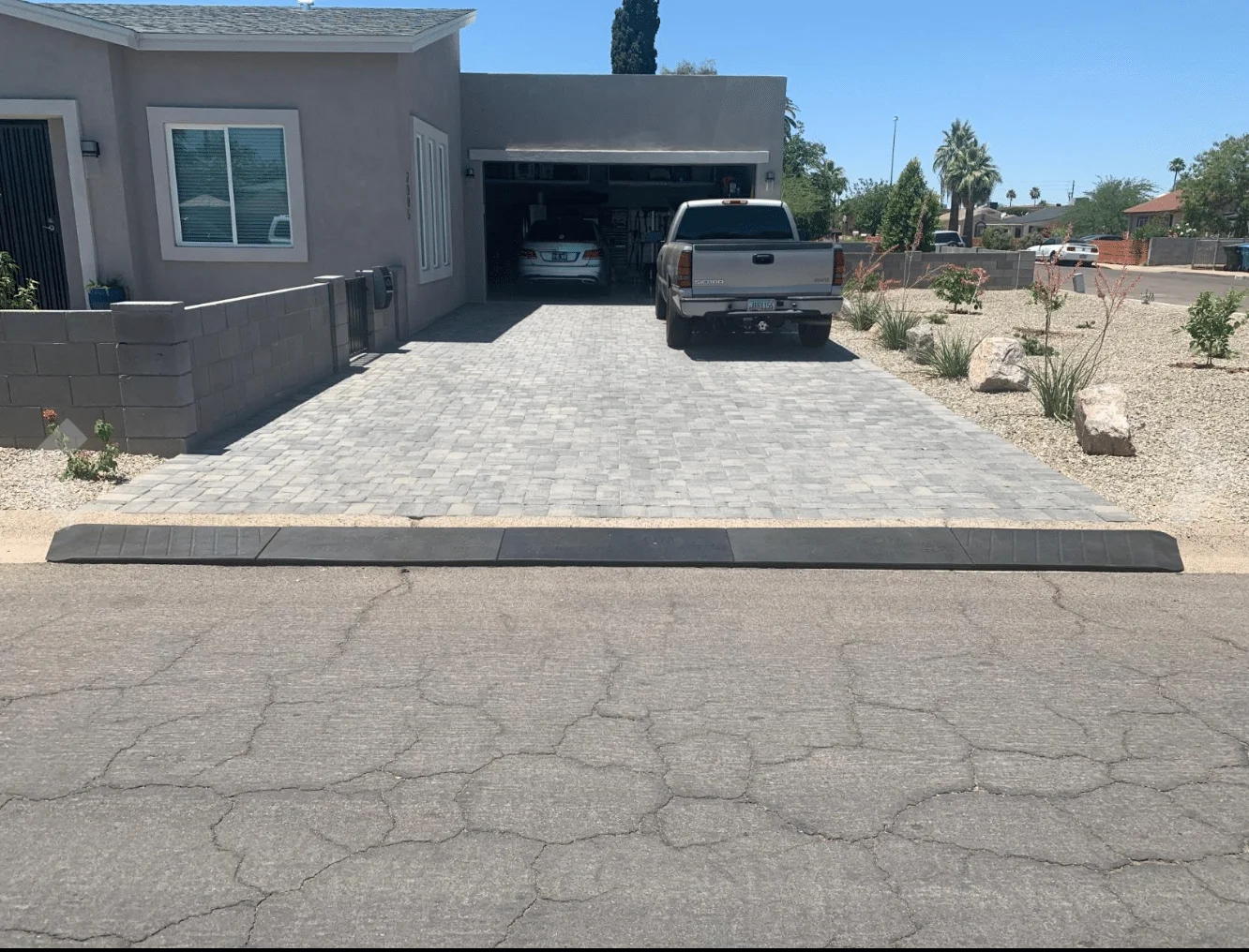 A Bridjit curb ramp installed in a driveway