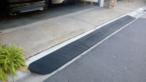 A Bridjit curb ramp installed in a driveway
