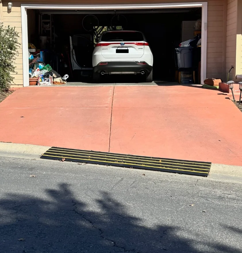 A driveway with a steep driveway curb